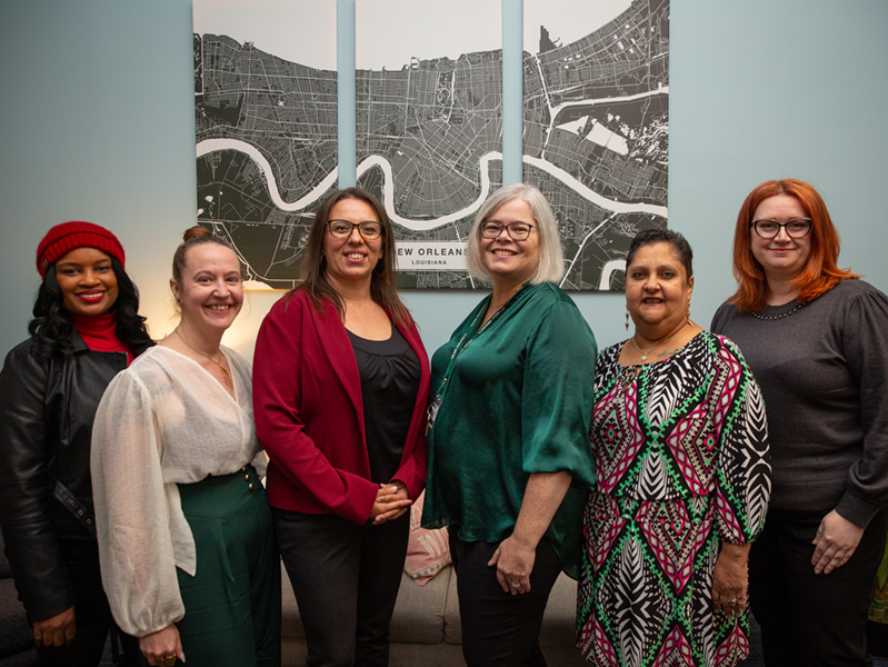 academic affairs staff, wearing Christmas colors