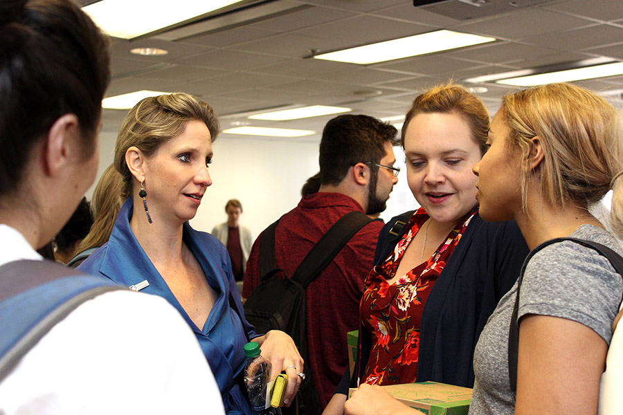 Dr. Rebekah Gee,talks with students