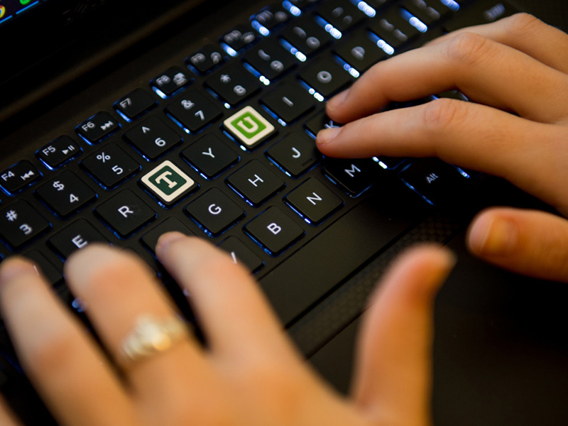 Keyboard with T and U highlighted as green and white with TU typefaces