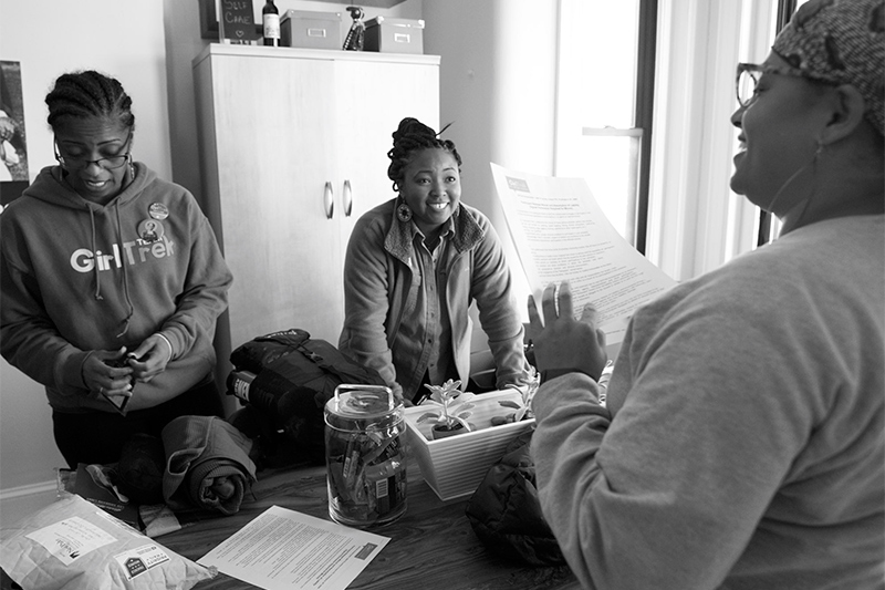 Alumna Chyna Johnson, center, discusses the logistics of the journey at the national GirlTrek office in Washington, D.C., on the day before the journey began. (Photo from GirlTrek)