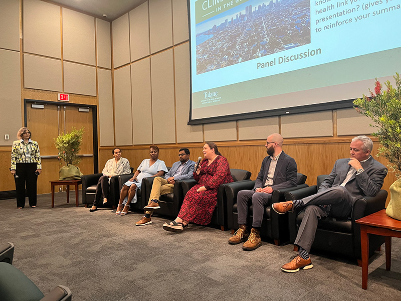 Faculty group talking at a symposium
