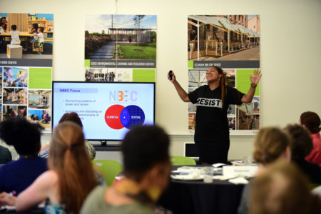woman leading a training at an anti-racism session