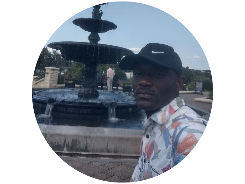 Tchalare Makagni standing near a fountain