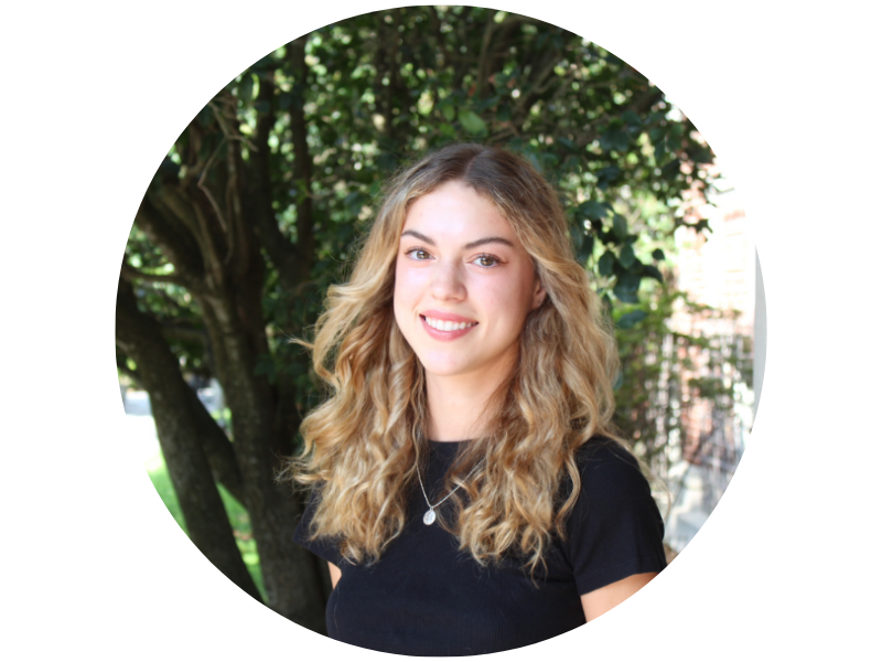 Hayden Gankendorff headshot, smiling standing in front of tree