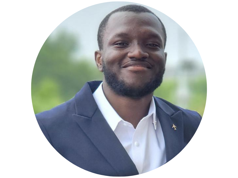 KWAME ASAMOAH SENYAH, a smiling man with a beard in a dark blue suit and white shirt.