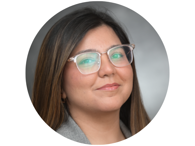 Professional headshot of Sumaira Lalani with long dark hair and clear glasses.