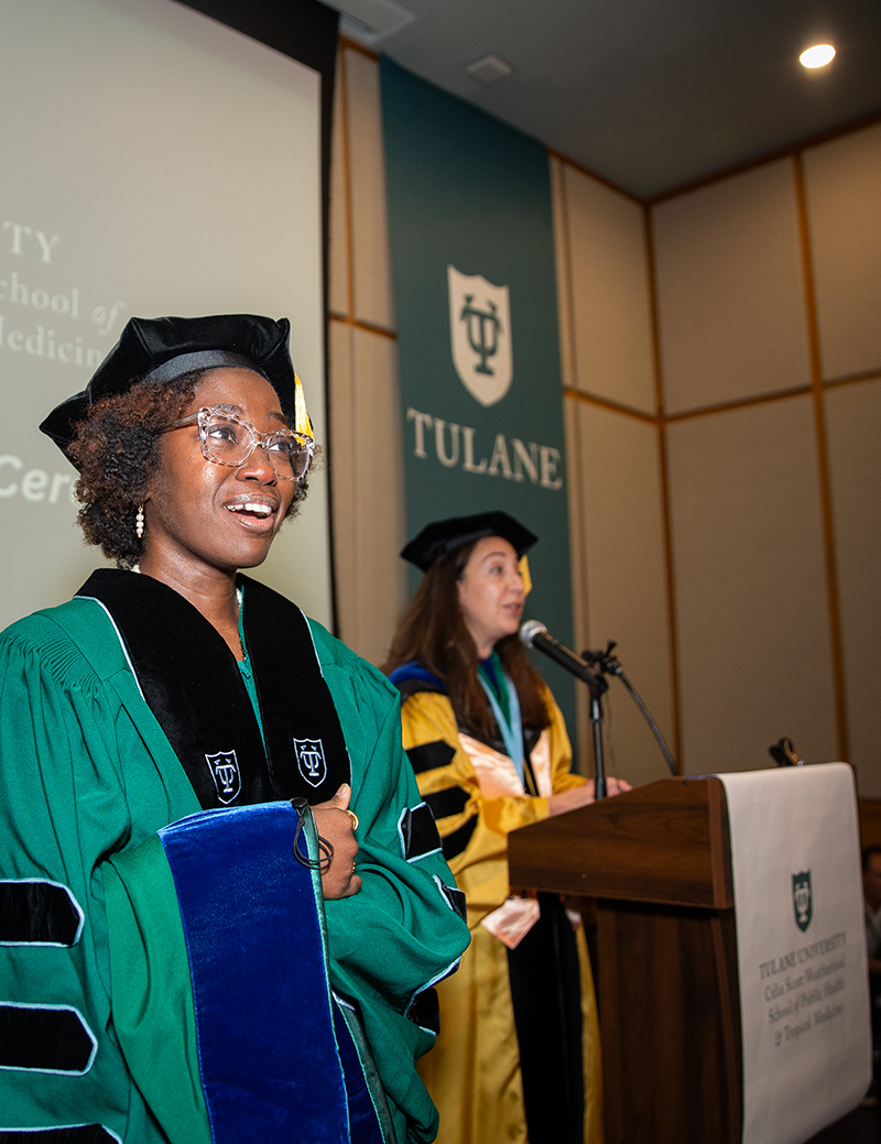 Doctoral stuent being hooded at the ceremony