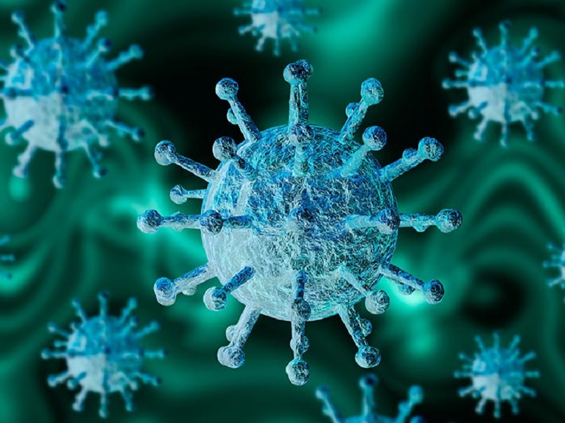 Up close image of coronavirus with blue and green microscopic dye