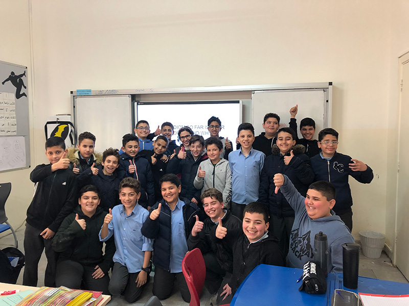 Rimawi with her students at the Islamic Educational College Boys' School.