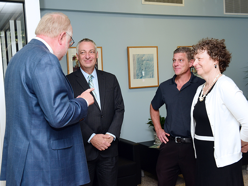 SPHTM Dean Buekens and Tulane Provost Forman talk with Associate Dean Keating and Liz Langlois