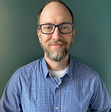 David Gladow, headshot, smiling at camera