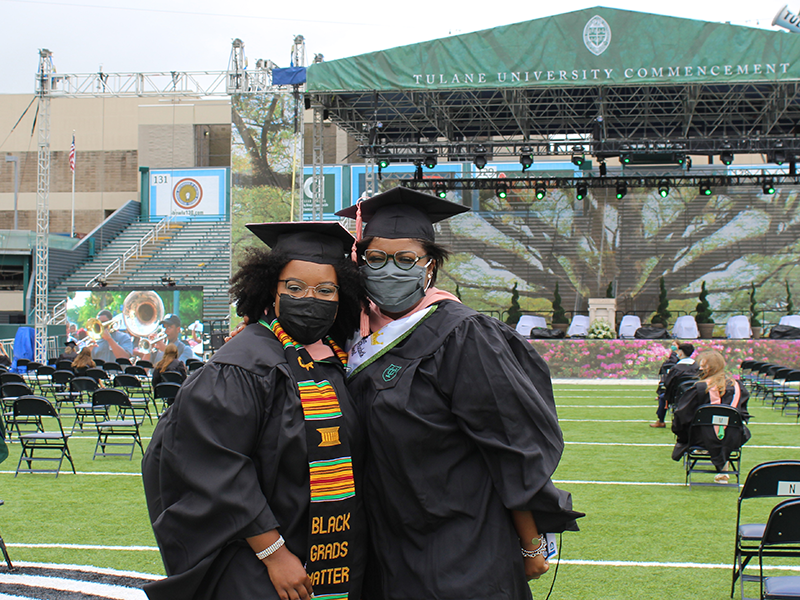 Two 2021 SPHTM graduates in regalia