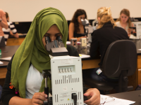 Tropical Medicine Student working at microscope