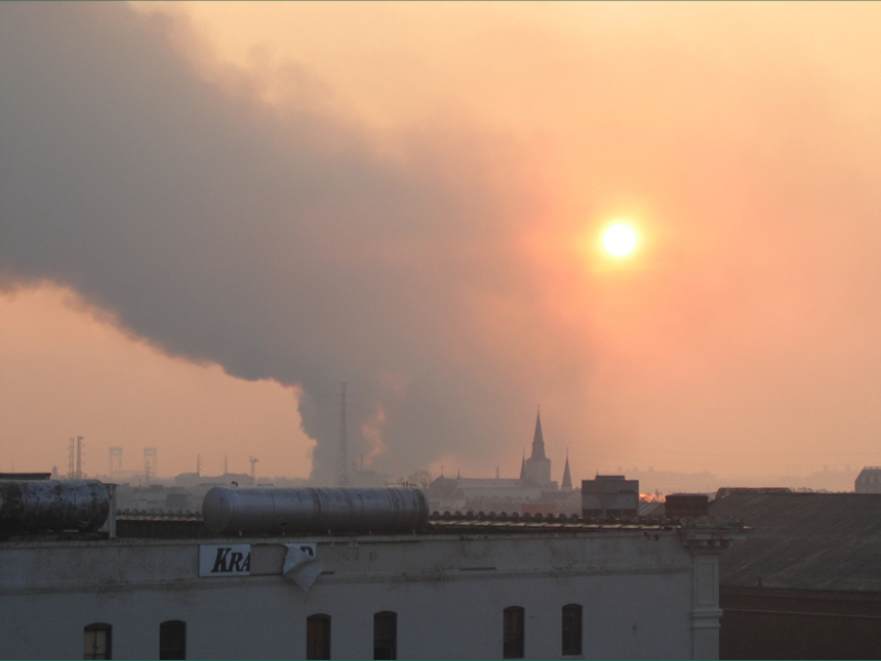Smoke in the air during a sunset in the direction of uptown